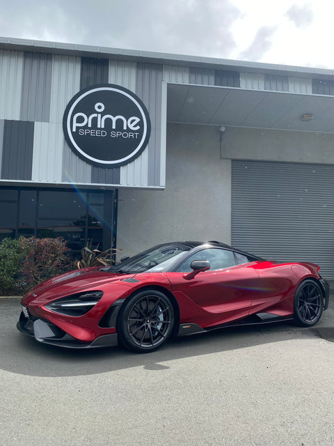Front 3/4 view of 2021 McLaren 765LT For Sale by Prime Speed Sport in New Zealand. Highly specced with full carbon pack and finished in MSO optioned Volcano Red exterior paint.