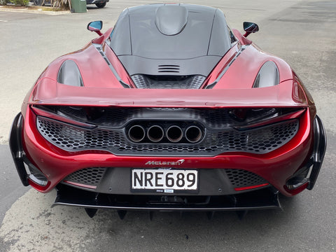 Rear view of exhausts on McLaren 765LT For Sale by Prime Speed Sport in New Zealand. Highly specced with full carbon pack and finished in MSO optioned Volcano Red exterior paint.