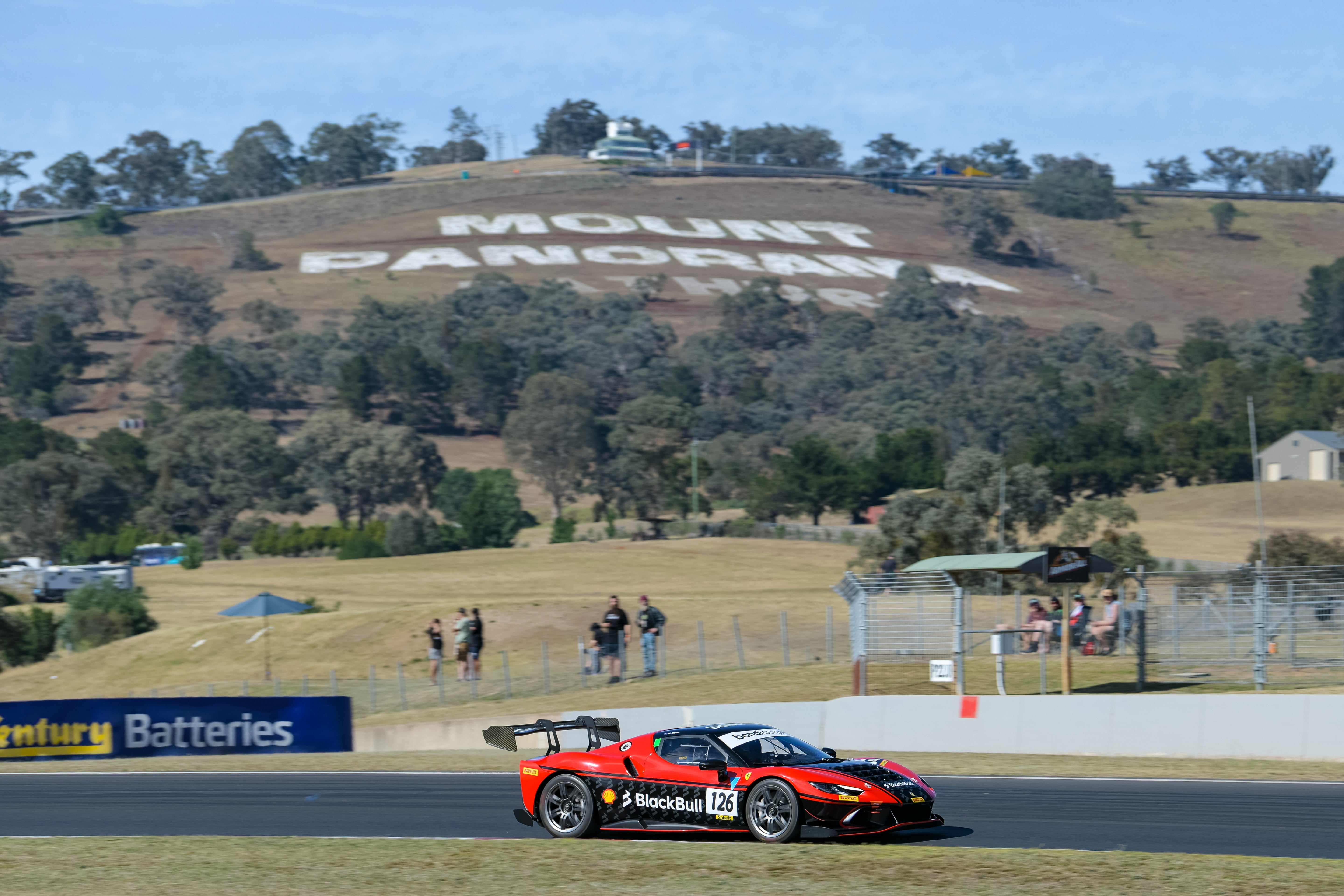 Red and Black Ferrari Challenge 296 at Mount Panorama Bathurst in New South Wales at Challenge Bathurst