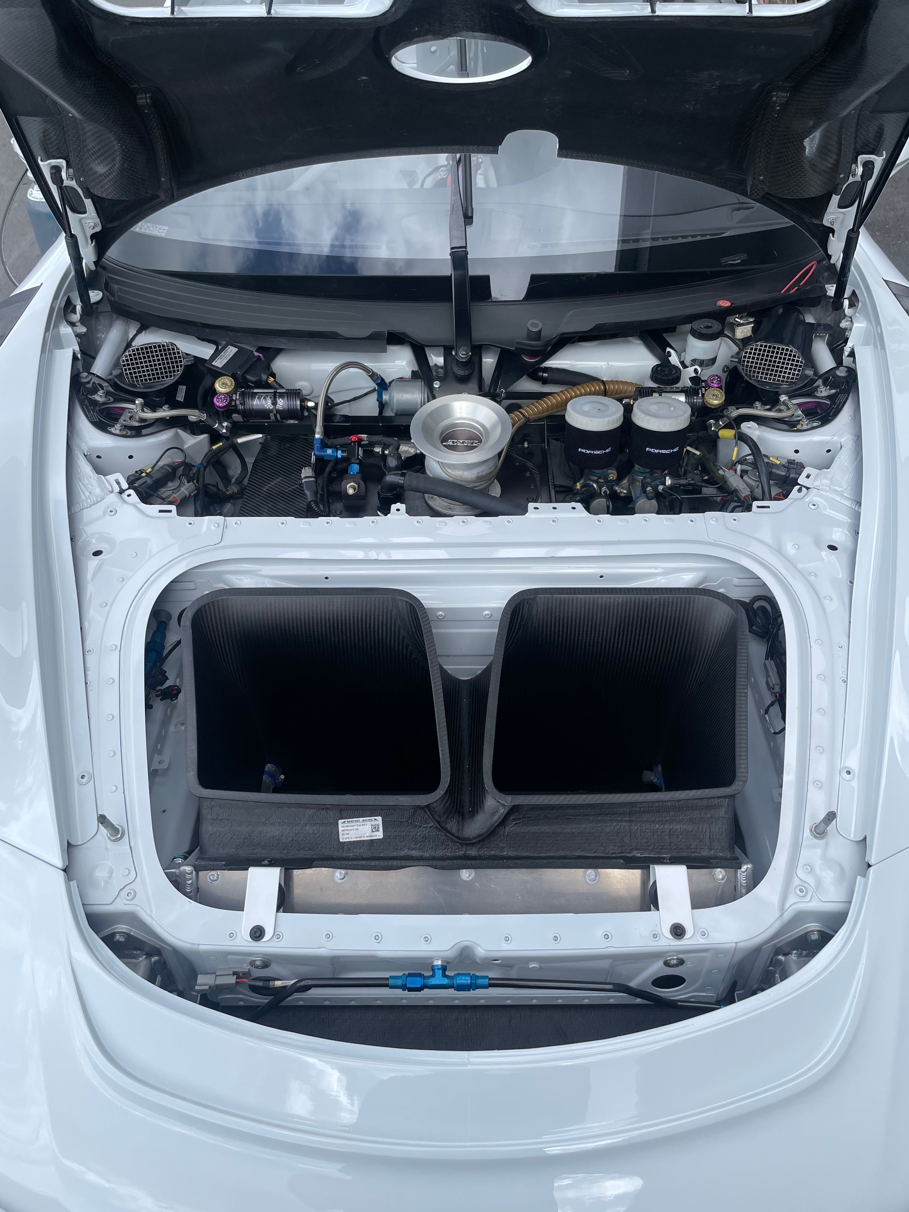 Under bonnet Porsche GT3 Cup MR SP-Pro in White FOR SALE at Prime Speed Sport, New Zealand. Endurance Fuel Filler view and central radiator shot. 3 way KW dampers.