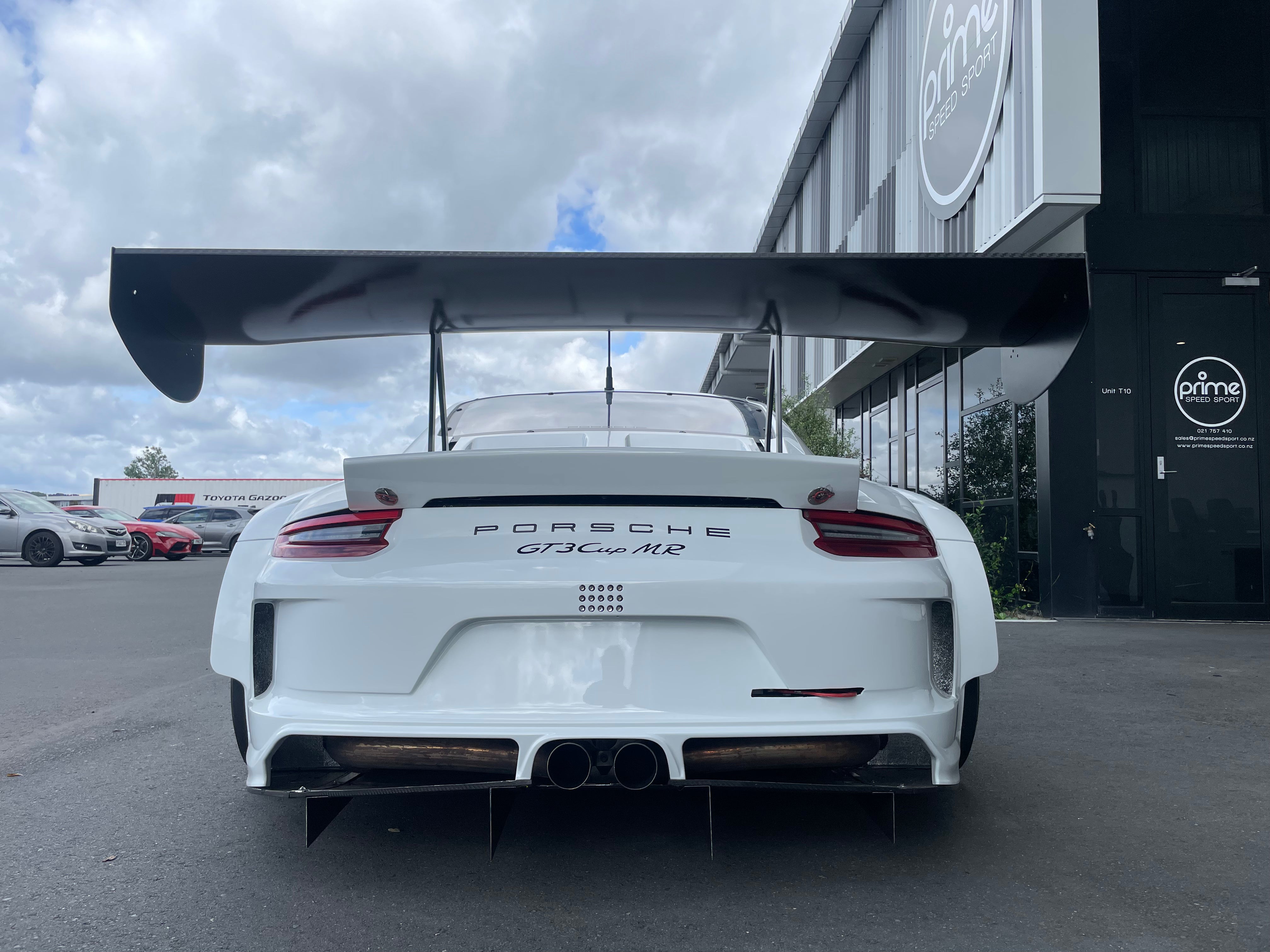 Rear View of Porsche GT3 Cup MR SP-Pro in White FOR SALE at Prime Speed Sport, New Zealand. Features the wide SP-Pro rear wing and Porsche Supercup exhaust system.