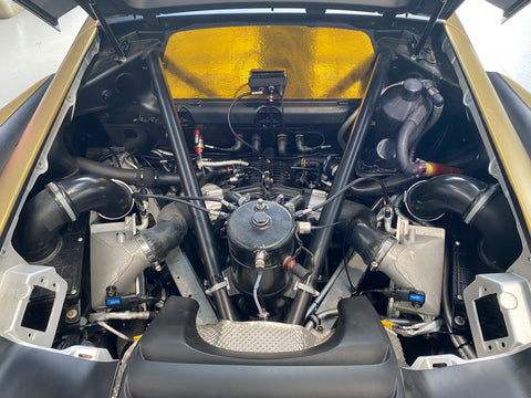 Engine bay of McLaren 650S GT3 with the gold foil heat protection. For Sale at Prime Speed Sport in New Zealand. Chassis 019.