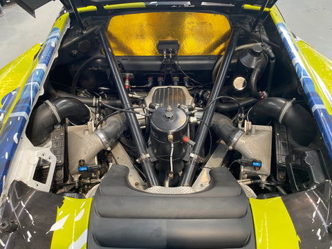 Gold lined engine bay of a McLaren 650S GT3. Chassis 006 FOR SALE at Prime Speed Sport in New Zealand.