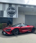 Front 3/4 view of 2021 McLaren 765LT For Sale by Prime Speed Sport in New Zealand. Highly specced with full carbon pack and finished in MSO optioned Volcano Red exterior paint.