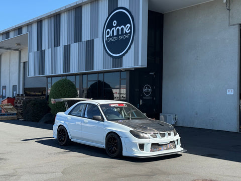 White and Carbon Exposed Subaru Impreza WRX STI Version 8 Spec C, Racing Car outside Prime Speed Sport Hampton Downs