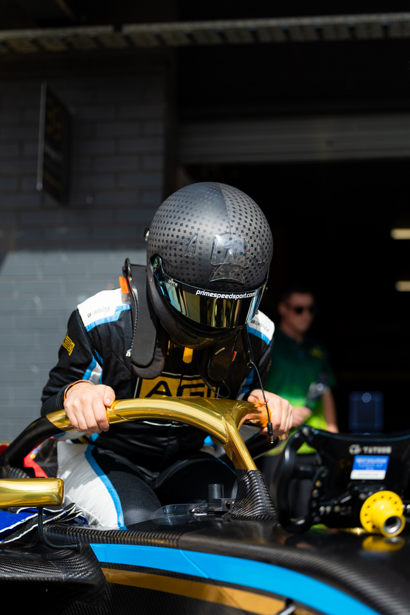 Prime Speed Sport Driver William Beck getting into his AUF4 car at Sydney Motorsport Park