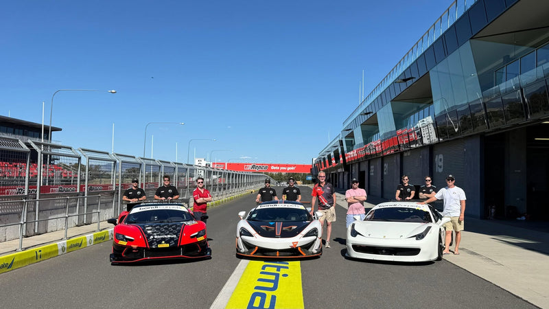 Prime Speed Sport crew and drivers, in the bathurst pit lane at mount panorama
